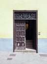 Old brown wooden door with panels in a traditional spanish house Royalty Free Stock Photo