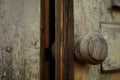 Old brown wooden door with a round knob Royalty Free Stock Photo