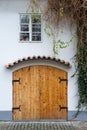 Old brown wooden door with vintage handle and decorations Royalty Free Stock Photo