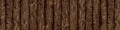 Old brown wooden log wall wide texture. Weathered wood rustic panoramic background Royalty Free Stock Photo