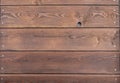 Old brown wooden wall with hole Royalty Free Stock Photo