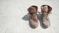 Old brown work boots covered in concrete Royalty Free Stock Photo