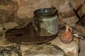 The Old bucket and the clay jug on the water well in Nazareth Village, Israel.