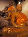 Old Buddha statue with disciple in old temple Thailand