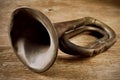 Old bugle on a wooden surface Royalty Free Stock Photo