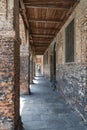 Old building with arched walkway with pillars of bricks and a wooden ceiling in the city of Este, Padua, Italy Royalty Free Stock Photo
