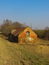 Old building of a collapsed barn in a field on a farm in Latvia Royalty Free Stock Photo
