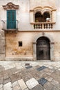 Old building facade. Vintage scene, door and windows Royalty Free Stock Photo