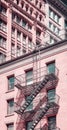 Old building with fire escape in New York City, color toning applied, USA Royalty Free Stock Photo