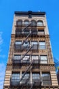 Old building with fire escape stairs in Soho, NYC Royalty Free Stock Photo