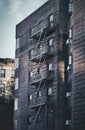 Old building with fire escape at sunset, NYC Royalty Free Stock Photo