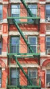 Old building with green fire escape, New York City, USA Royalty Free Stock Photo