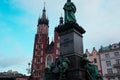 Old, Aged Buildings with stautes in the heart of Krakow, Poland. Royalty Free Stock Photo