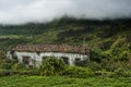 Old building and mountains of flores, acores