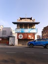 Old building near a road with new car Royalty Free Stock Photo