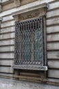 Old building with a nice  metal window and historic  architecture in Rome Italy Royalty Free Stock Photo