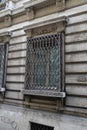 Old building with a nice  metal window and historic  architecture in Rome Italy Royalty Free Stock Photo