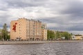 The old building on Primorsky Prospekt in St. Petersburg. The panel of Soviet times depicts Red Army soldiers