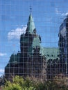 Old building reflected in new