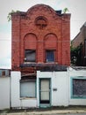 Abandoned Decaying Red Brick Building Exterior.