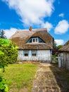 Old building with thatched roof in Wiek, Germany