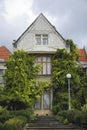 An old building with triangular roof.