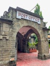 An old building with walls made of stones residing the post office at Pune Maharashtra India Royalty Free Stock Photo