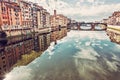 Old buildings and beautiful Ponte Santa Trinita mirrored in Arno Royalty Free Stock Photo