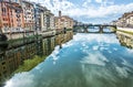 Old buildings and beautiful Ponte Santa Trinita mirrored in the Royalty Free Stock Photo