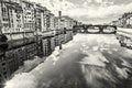 Old buildings and beautiful Ponte Santa Trinita mirrored in the Royalty Free Stock Photo