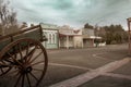 Old buildings and cart wheel in street in Eltham, Taranaki