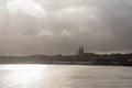 Selective blur on a sunset of a Winter Panorama of the garonne river seen from Garonne quay Quais de la Garonne in bordeaux