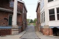 Old buildings and cobbled street inside Fort Jay on Governors Island, New York Royalty Free Stock Photo