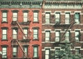 Old buildings with fire escapes, color toning applied, New York City, USA Royalty Free Stock Photo