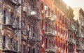 Old buildings with fire escapes in New York City, color toning applied, USA Royalty Free Stock Photo