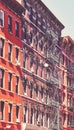 Old buildings with fire escapes in New York City, color toning applied, USA Royalty Free Stock Photo