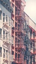 Old buildings with fire escapes in New York City, color toning applied, USA Royalty Free Stock Photo