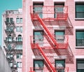 Old buildings with fire escapes in New York City, color toning applied, USA Royalty Free Stock Photo