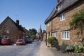 Cottages and a church spire in Adderbury, North Oxfordshire in the United Kingdom Royalty Free Stock Photo