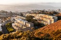 Old buildings on hill slope of Twin Peaks at sunrise