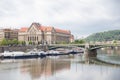 Old buildings and street view. Vltava river with glare. Travel photo 2019