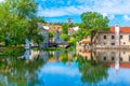 Old buildings in Viseu reflected on a local creek, Portugal