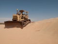 An old bulldozer abandoned in the middle of the desert in Saudi Arabia Royalty Free Stock Photo