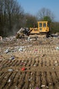 The old bulldozer moving garbage