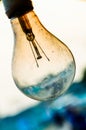 Old burnt lamp smoked inside. Royalty Free Stock Photo