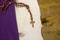 Old burnt parchment with a Catholic cross