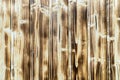 Old burnt wooden plank brown background with vertical boards Royalty Free Stock Photo