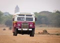 An old bus running rural road in Bagan, Myanmar Royalty Free Stock Photo