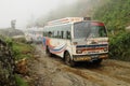 Old buses on very bad muddy road, Nepal Royalty Free Stock Photo