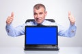 Old business man shows laptop and thumbs up Royalty Free Stock Photo